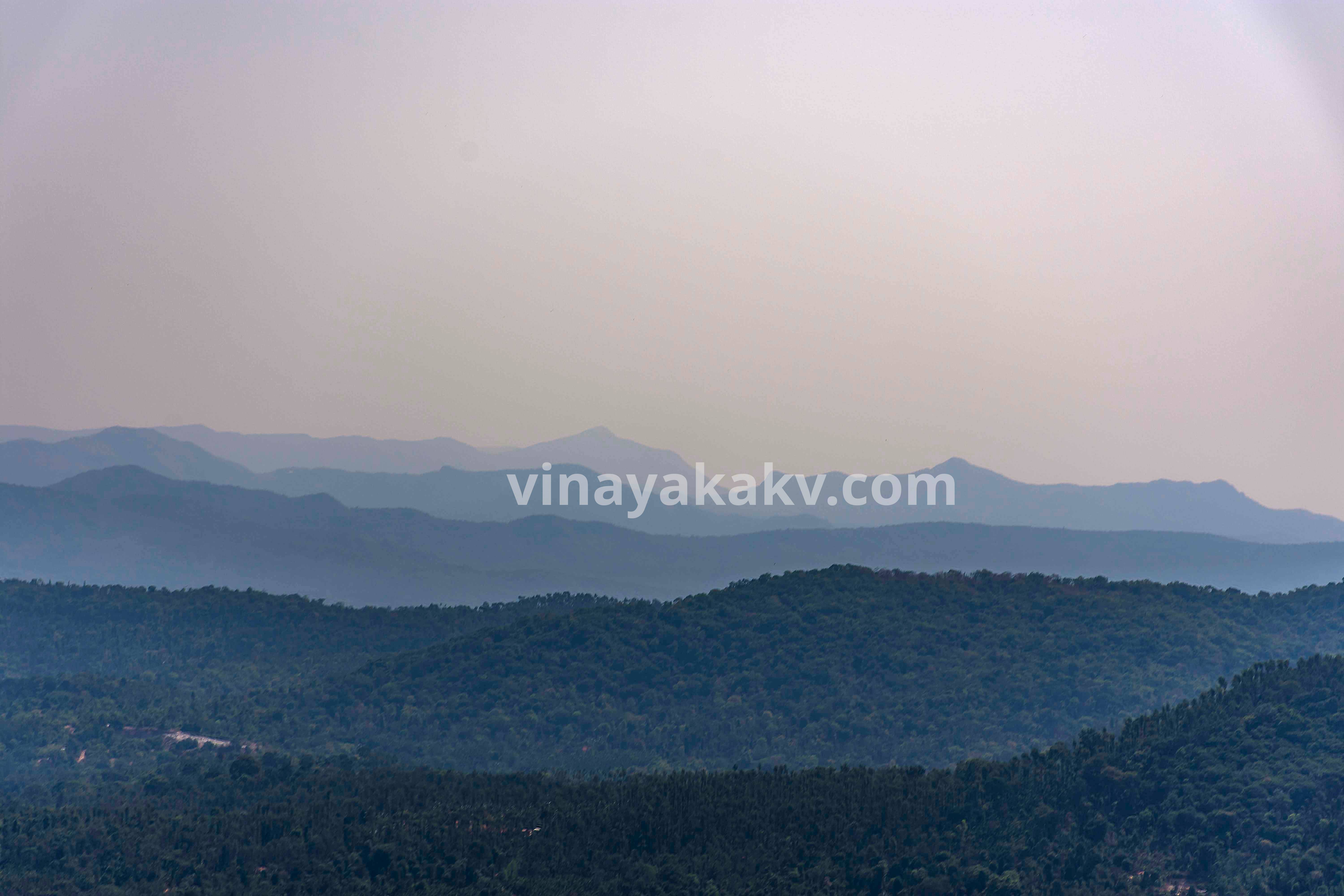 Mullayyanagiri along with Chandradrona range. Observe the range behind Mullayyanagiri, appearing behind its saddle point. The whole range is crescent-moon shaped, hence the name chandra-drona.