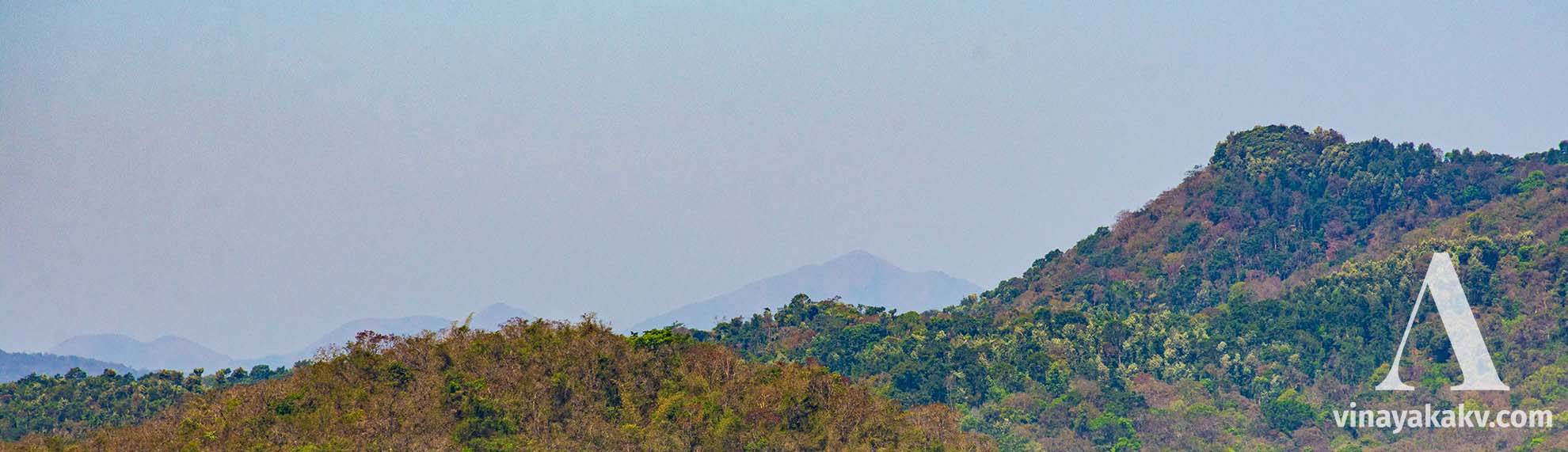 _Mertiparvata_, at last layer, as seen from _Mudigere_. Notice the deciduous forest in the first layer and semi-evergreen in the next. The _Mertiparvata_ hosts evergreen forests.